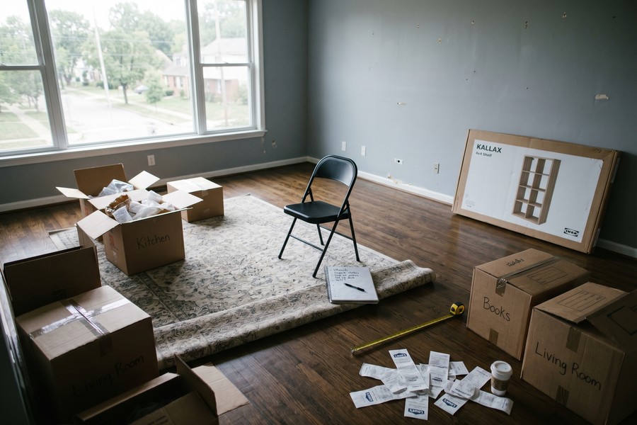 Remote worker reviewing relocation budget spreadsheet at a home office desk