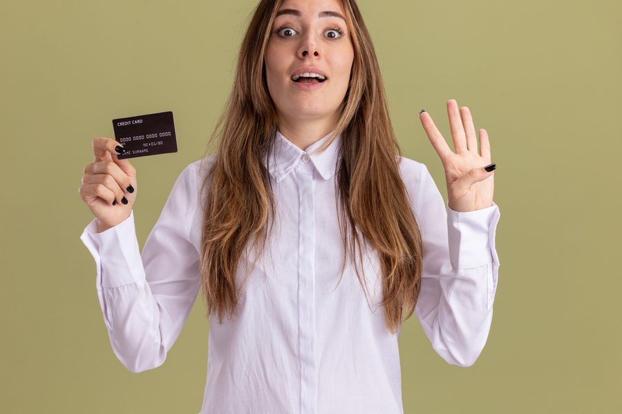 Split image showing a credit card on one side and loan documents on the other