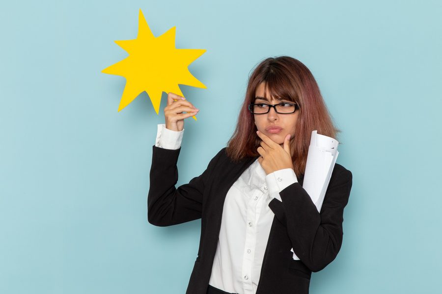 Financial advisor explaining down payment assistance program documents to first-time buyer