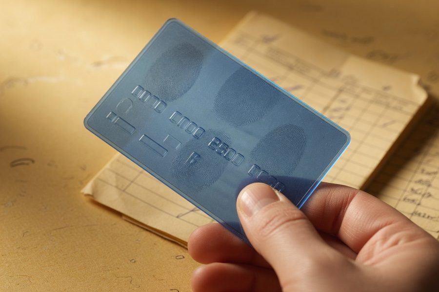 A secured credit card and a credit‑builder loan brochure side by side.