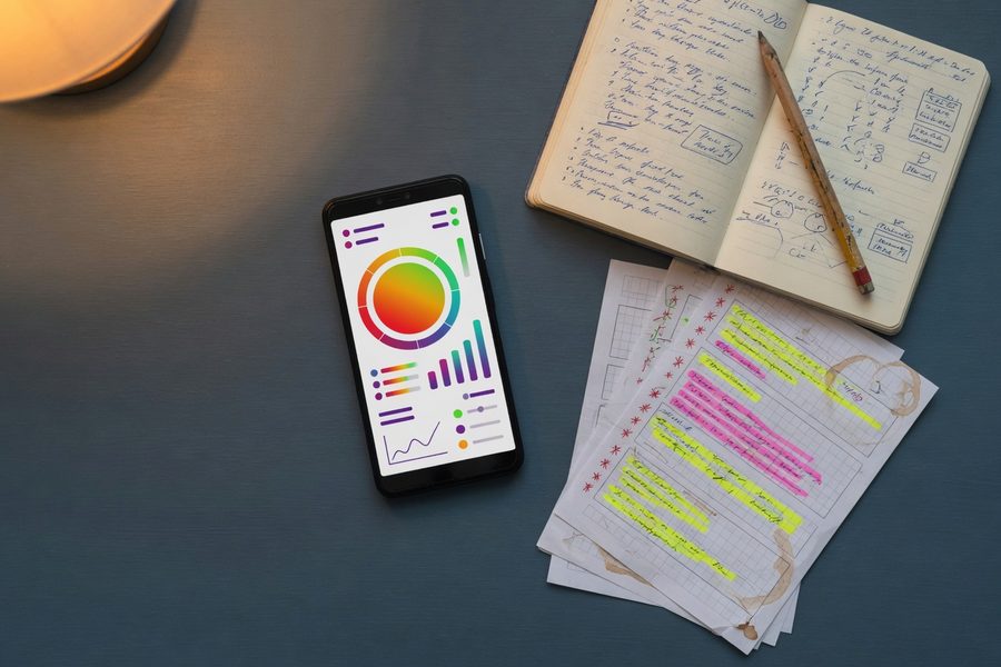 Smartphone screen showing a credit score simulator interface with hypothetical payoff options.