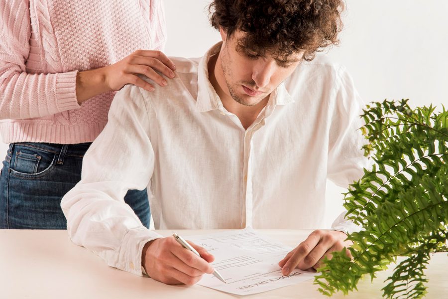 Credit union representative discussing green loan terms with borrower