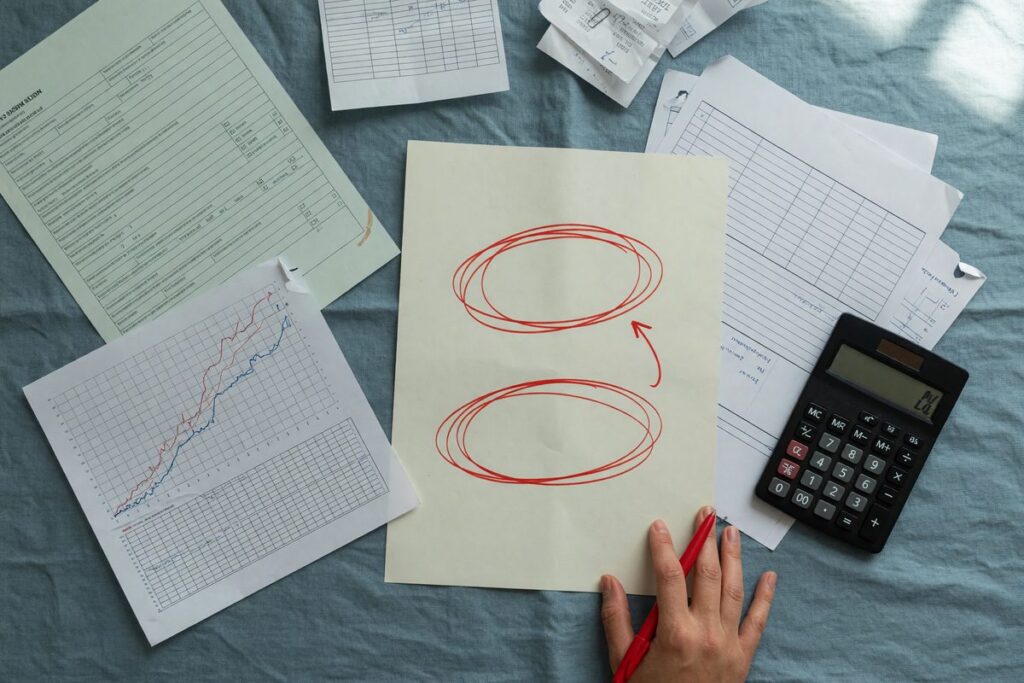 Close-up of a calculator and loan application form showing interest rate calculations