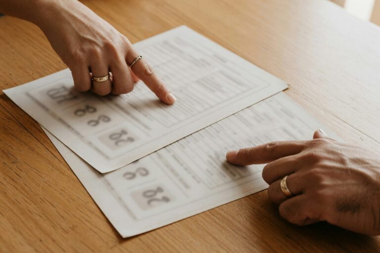 Couple reviewing credit scores and loan application documents at home
